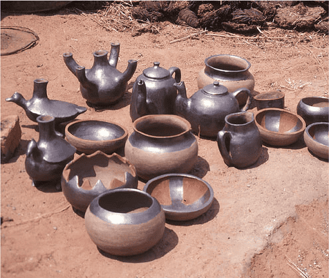 Pottery (including pots, cups, and bowls) in mud huts.